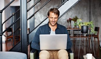 handsome guy using his laptop