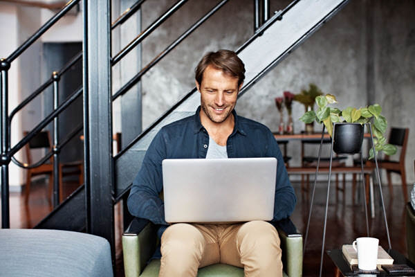 handsome guy using his laptop